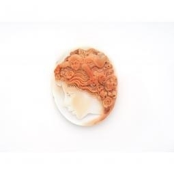 Woman with angel carved on natural seashell cameo