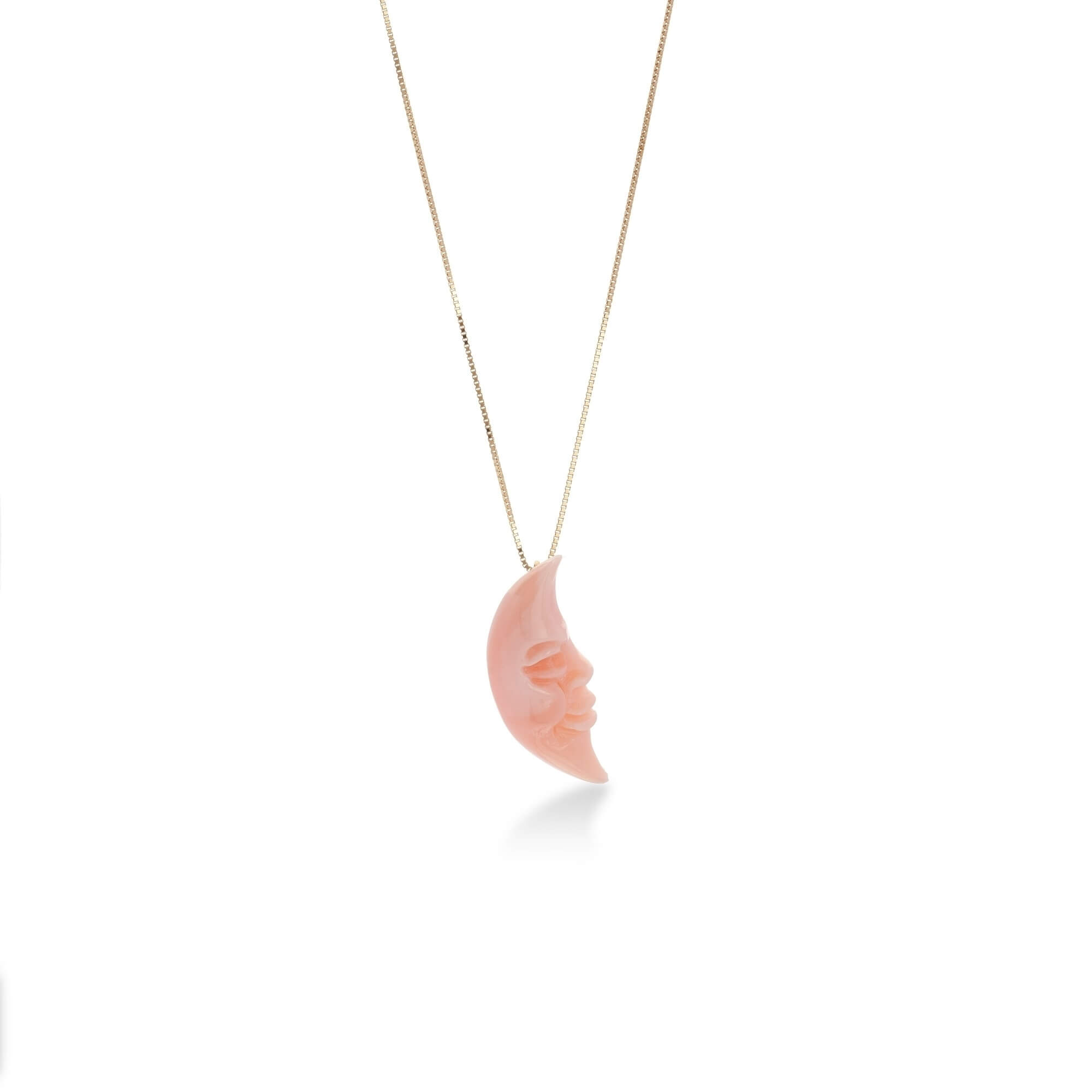 Moon carved on natural pink coral 