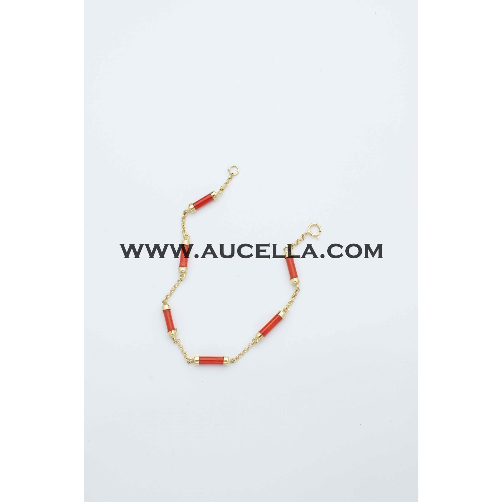 Bracelet with tube coral set in gold 