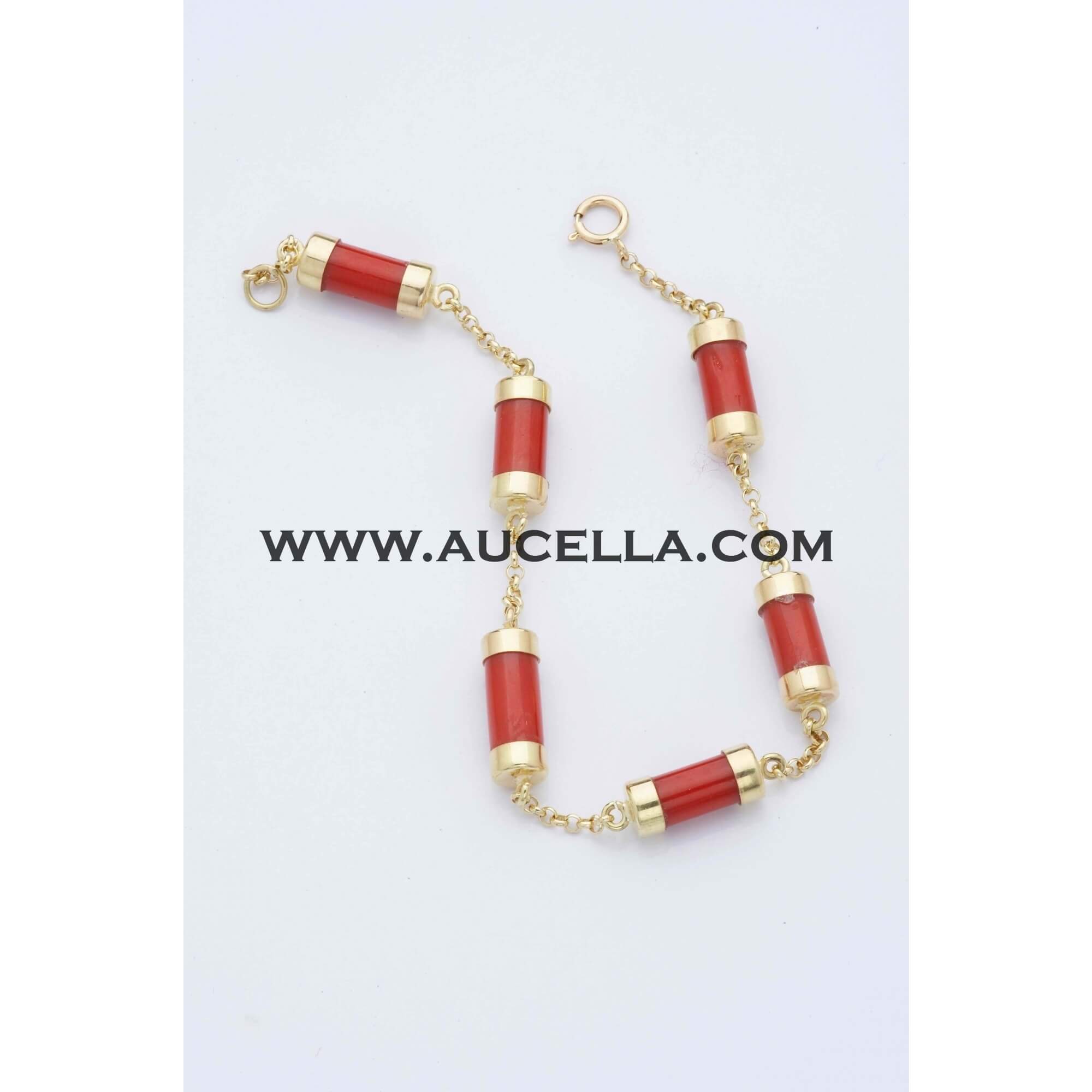 Gold bracelet with natural coral tube shape