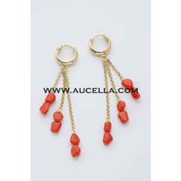 Earrings set in gold with small coral nuggets 