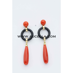 Earrings set in gold with coral and onyx