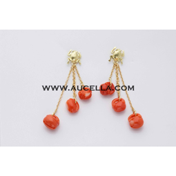 Earrings set in gold with red coral carving 