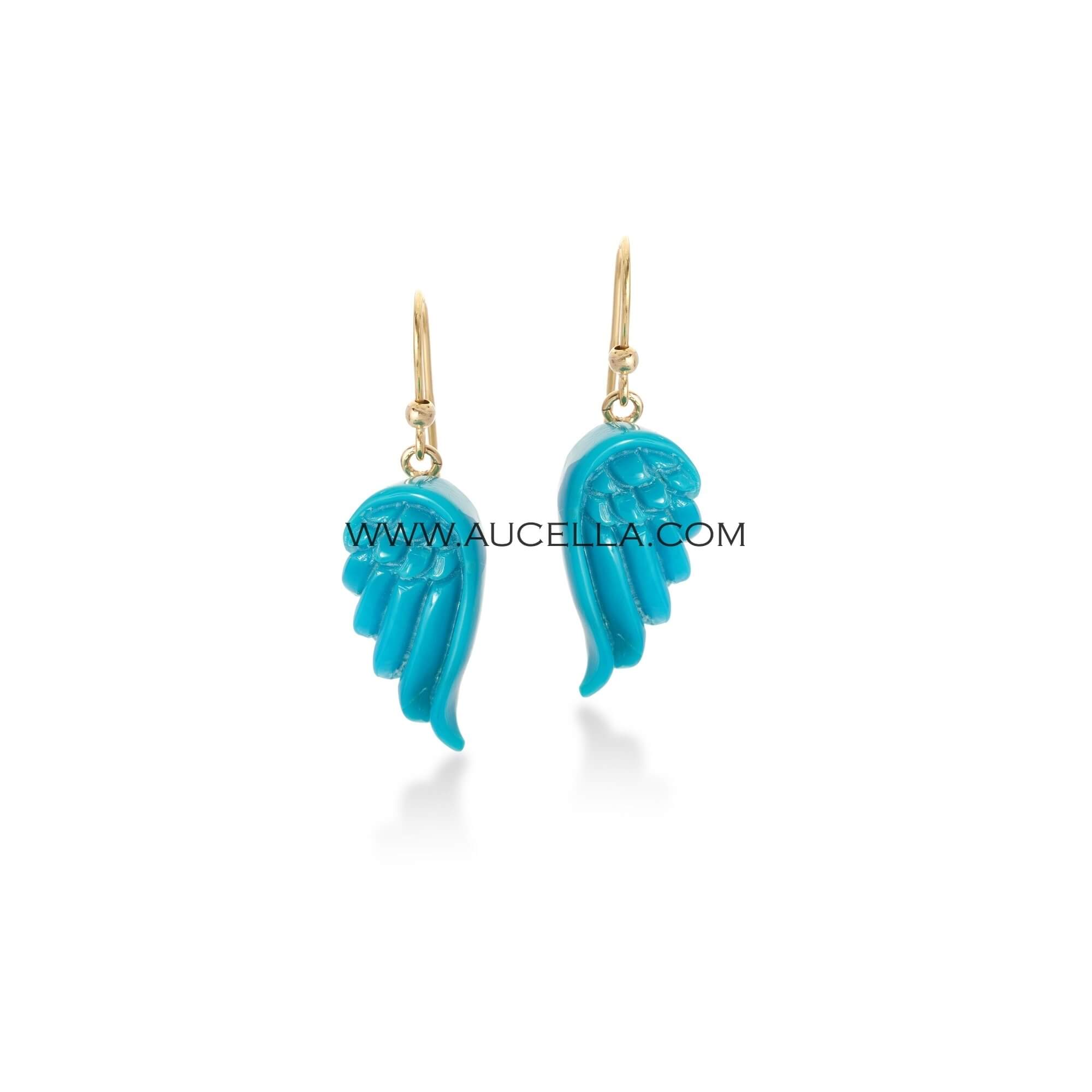 Natural turquoise wings set in gold 