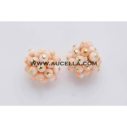 Earrings set in gold with pink coral beads