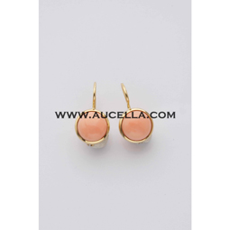 Earrings set in gold with round pink cabochon