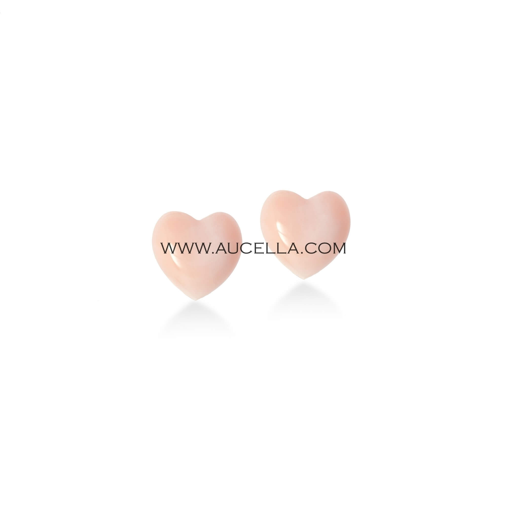 Hearts carved on natural pink coral and set in gold 