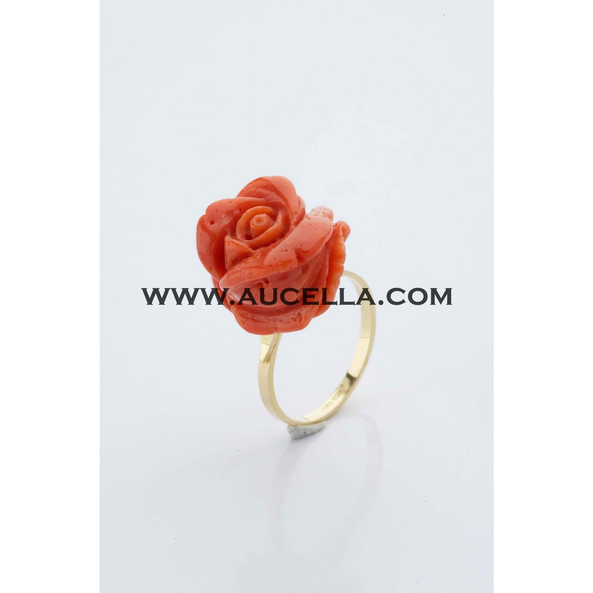 Ring set in gold with red coral 