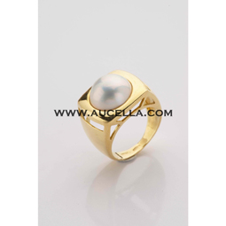 Natural mabe pearl set in gold 