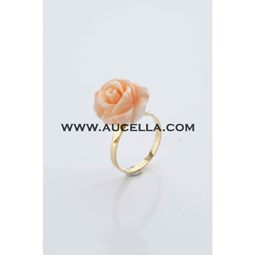 Ring set in gold with natural pink coral