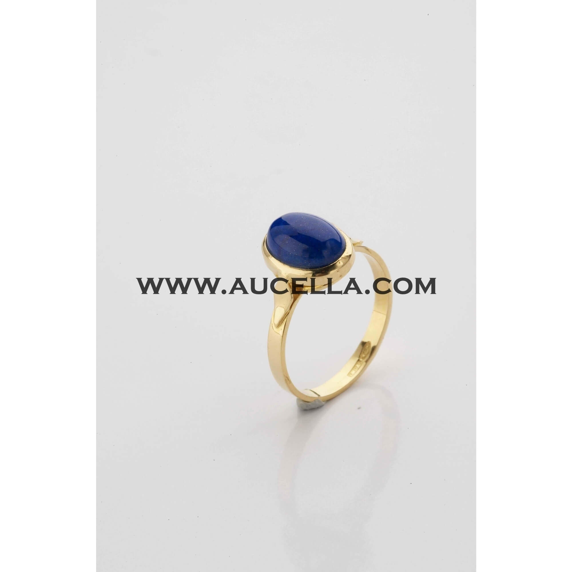 Ring set in gold with natural lapis cabochon 