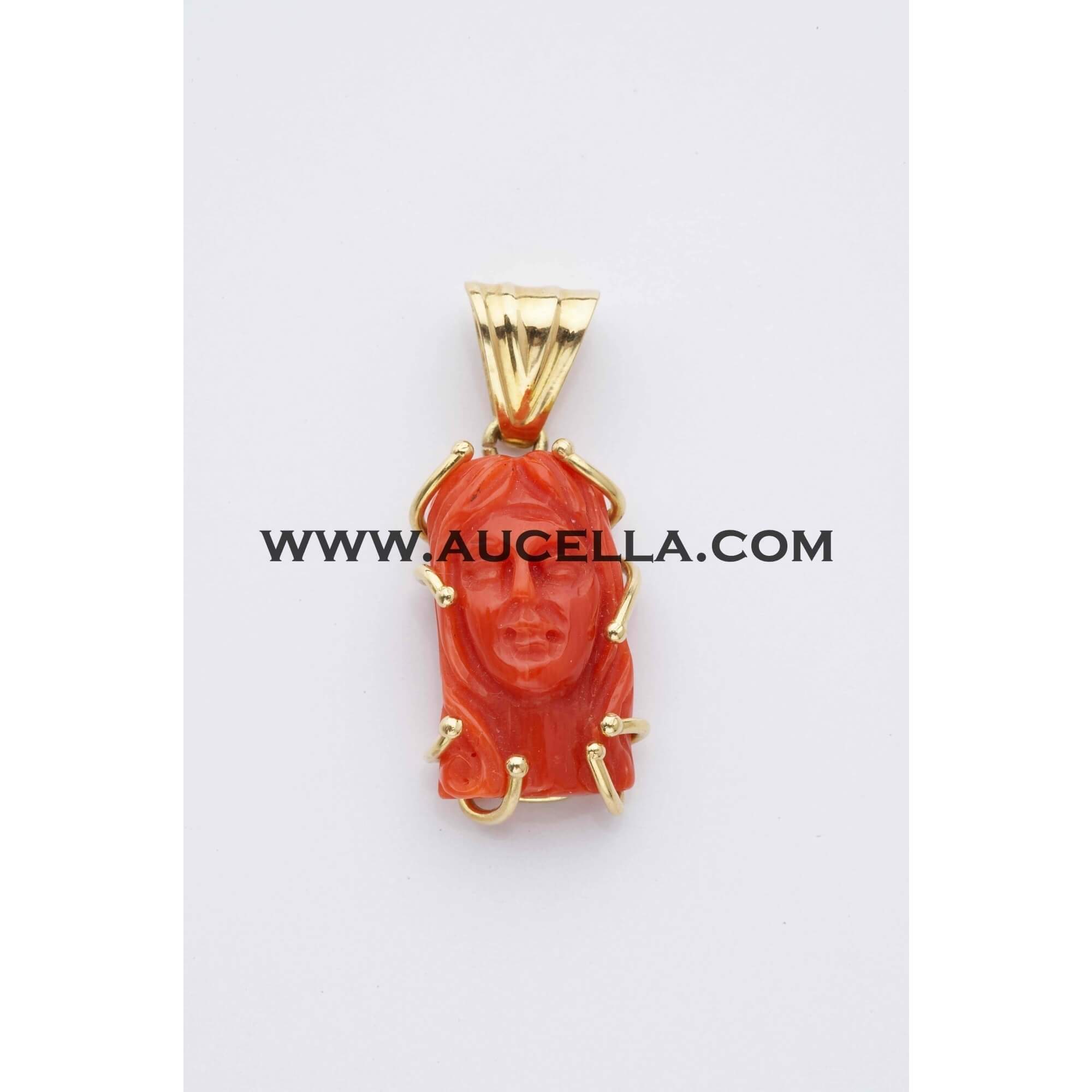 Pendant set in gold with Jesus face carving 