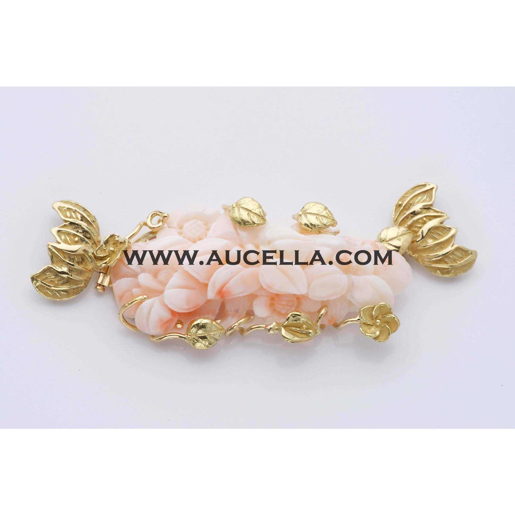 Clasp with pink coral set in gold 